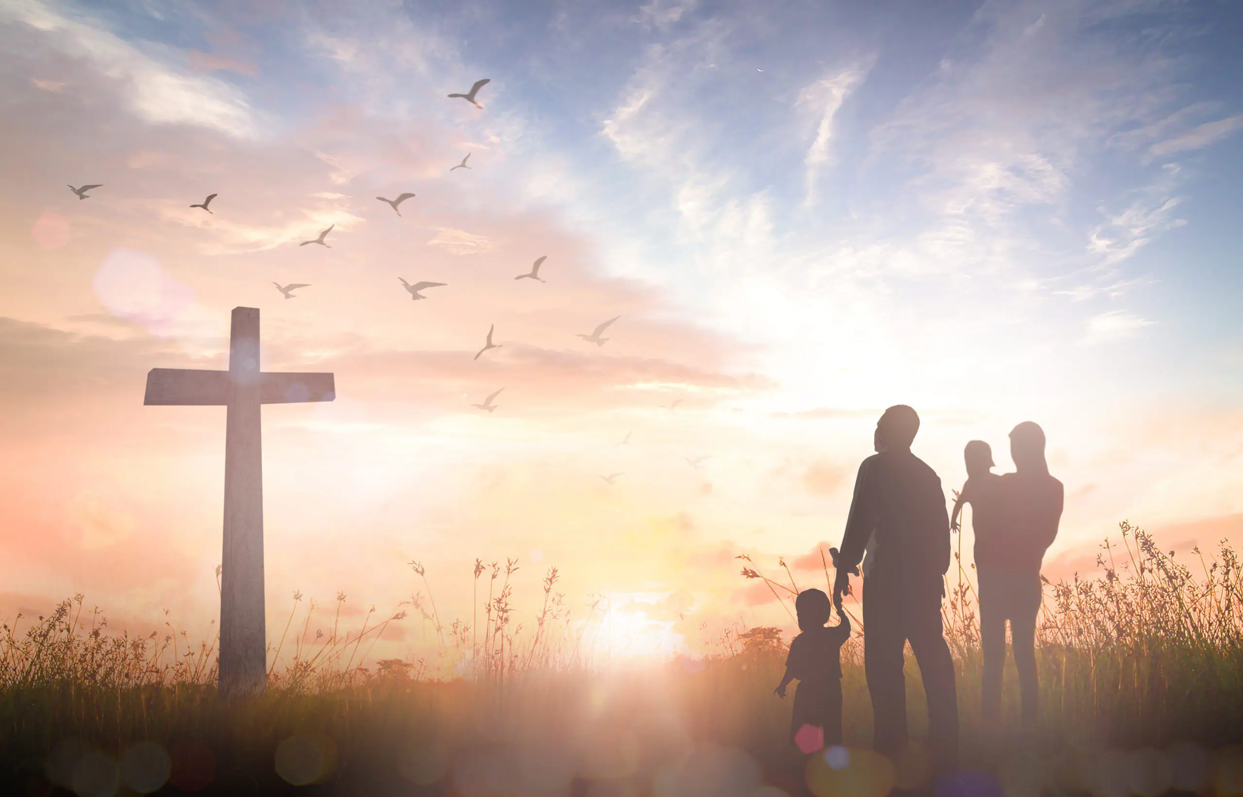 Family in front of a cross