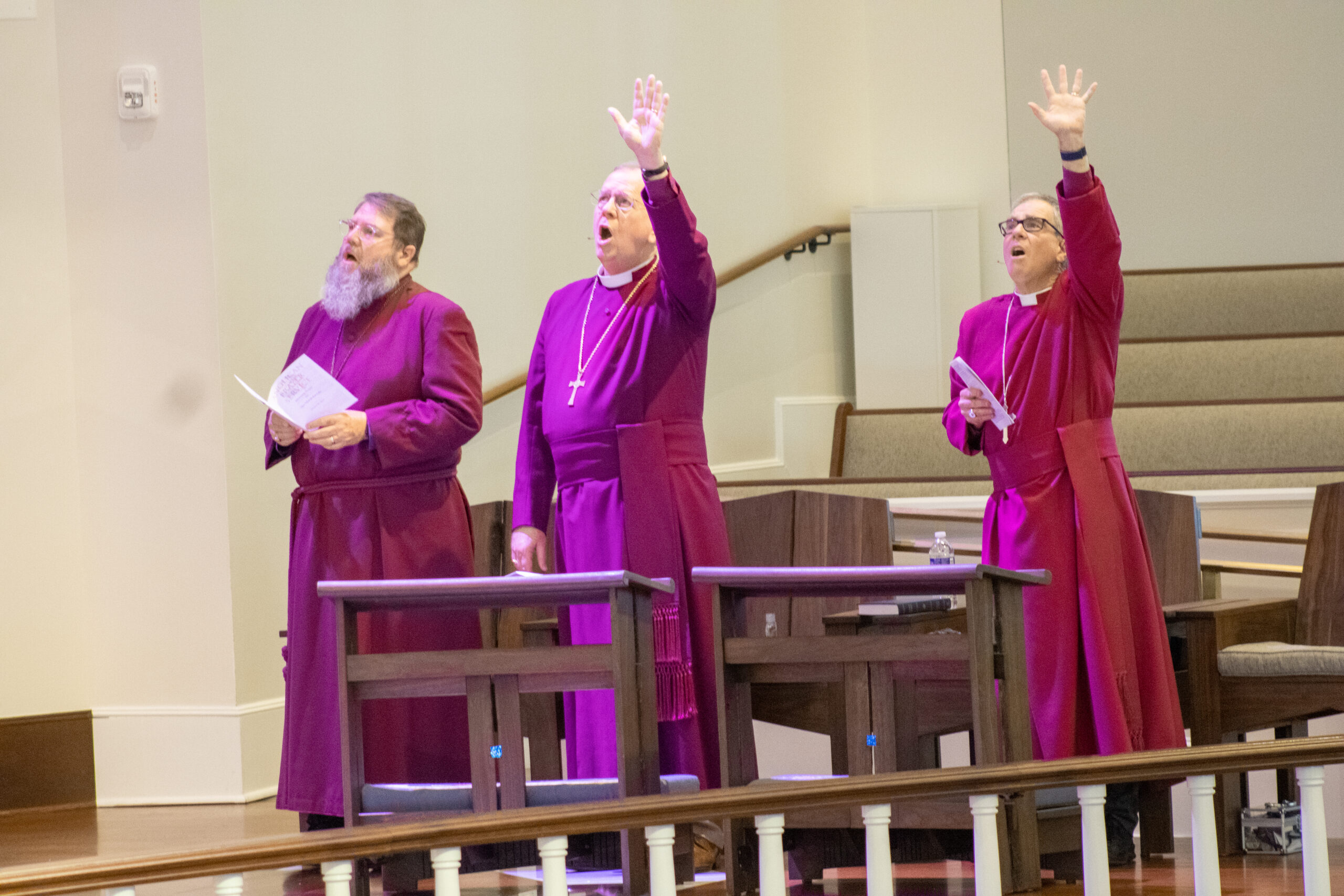 clergy members praising God
