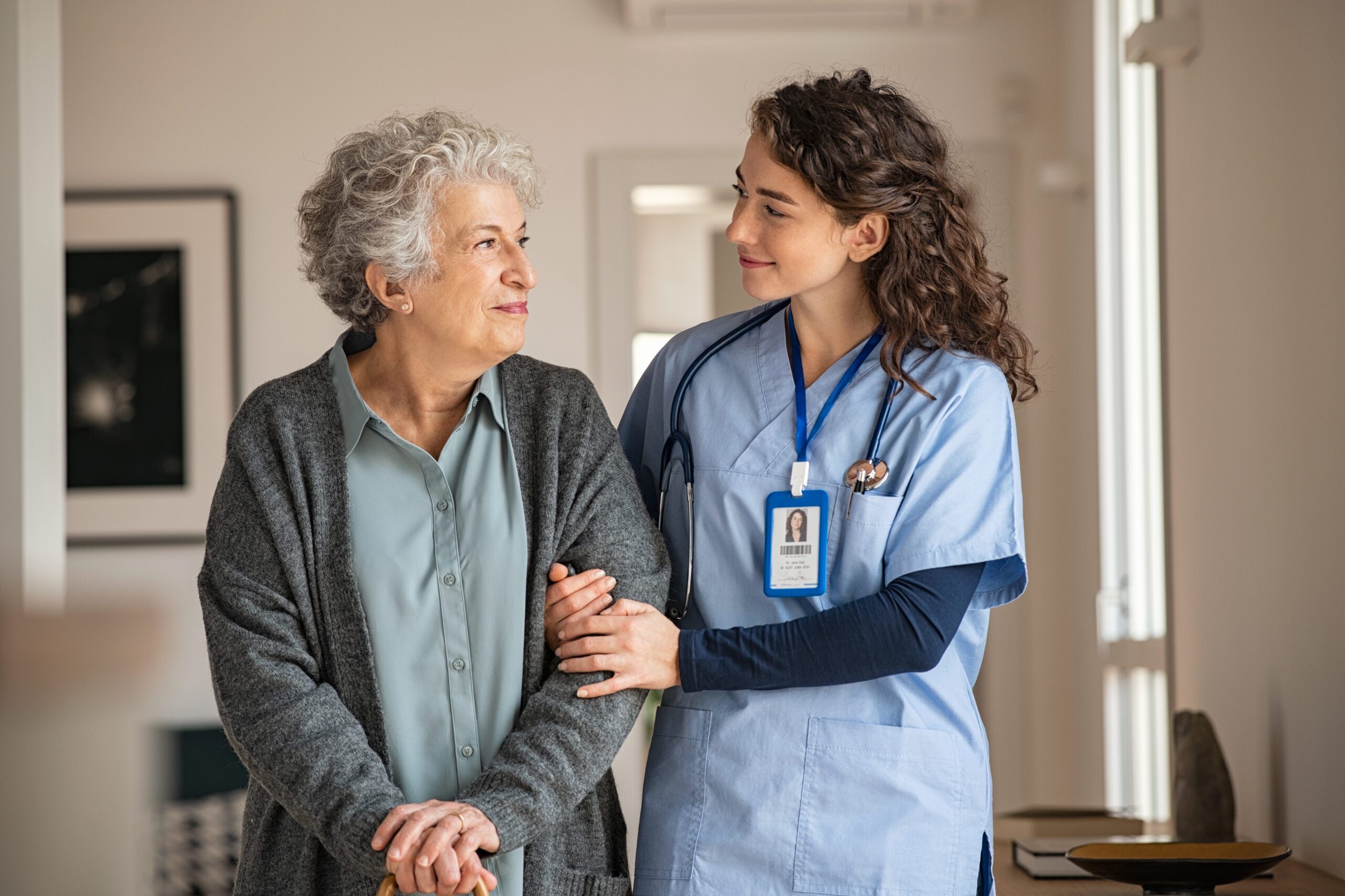 nurse caring for elderly woman