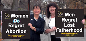 Founders of SNM holding "I regret my abortion" signs
