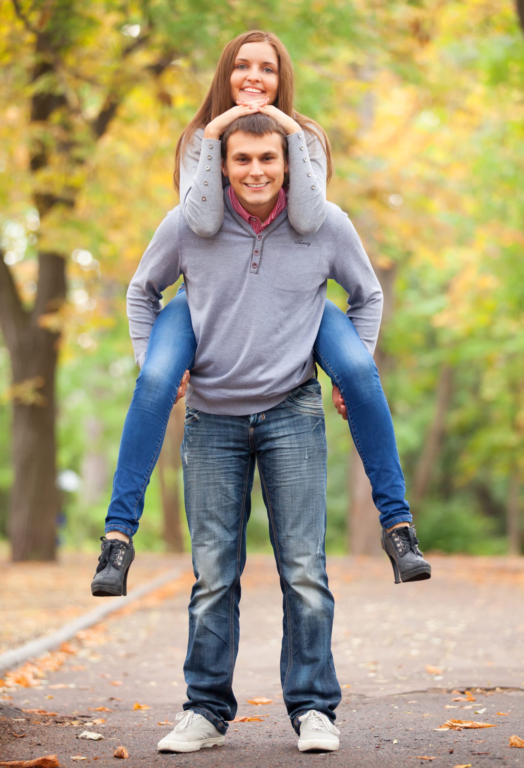 Teen couple at autumn park