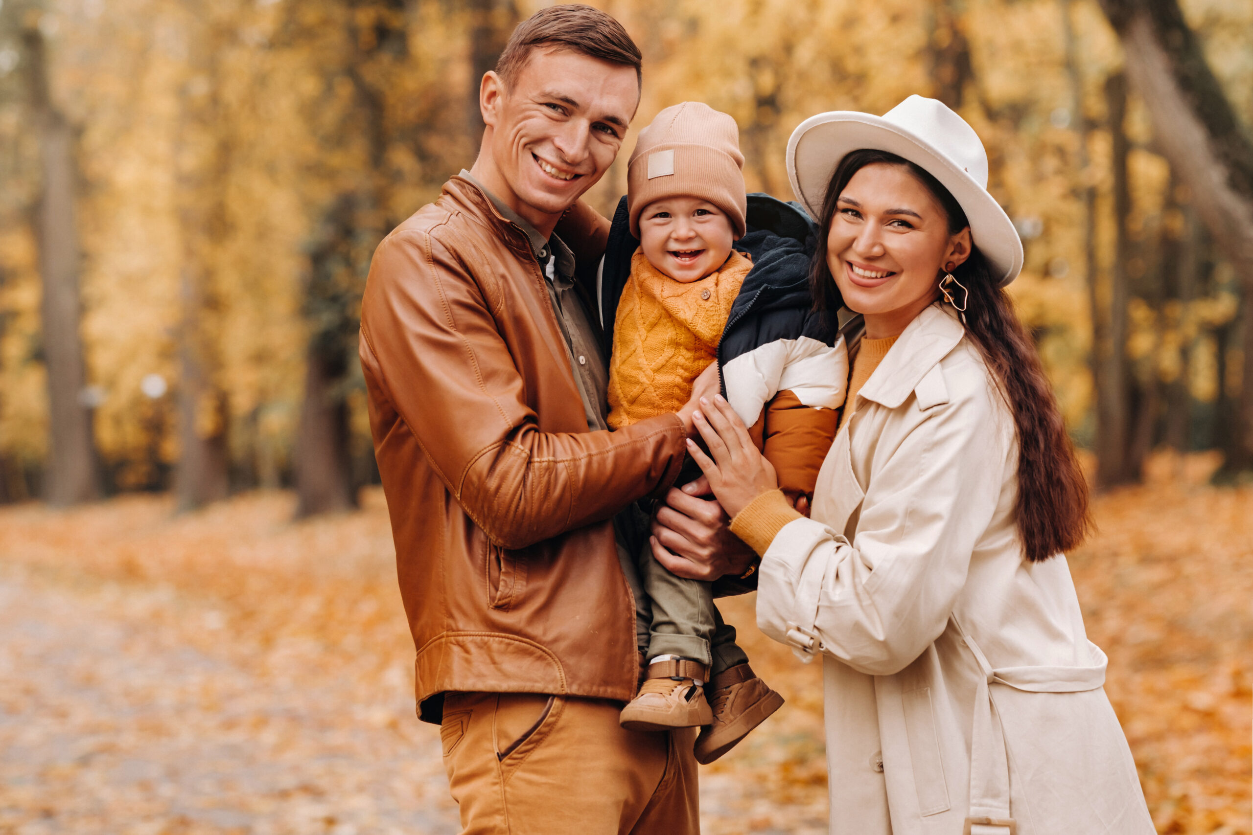 Parents with baby boy in the fall