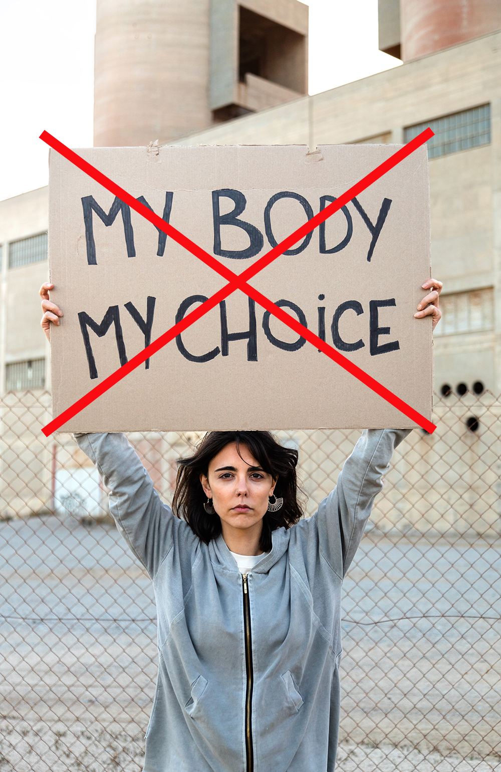 woman holding "my body, my choice" sign wiht an "x" over it.