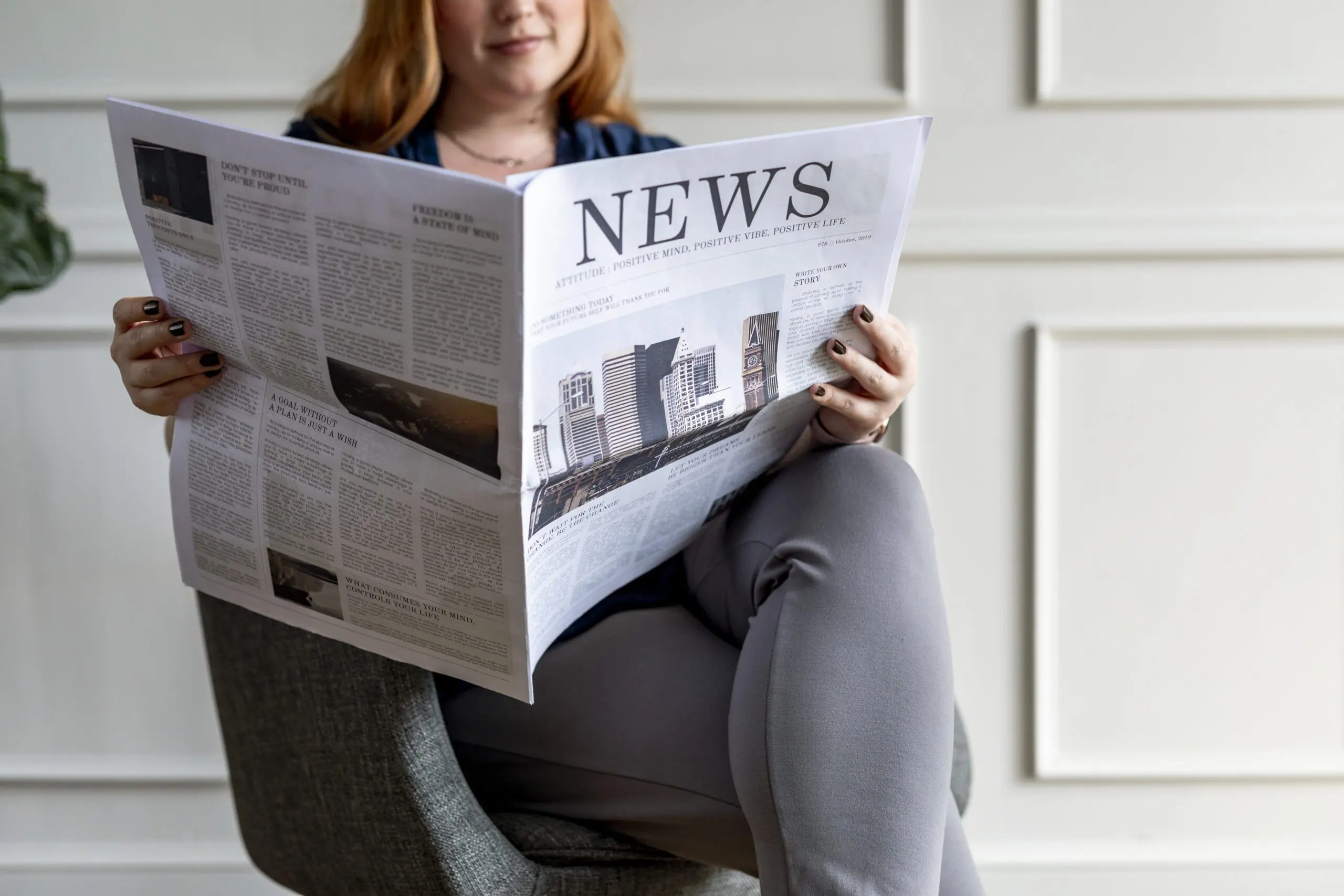 Woman reading a newspaper
