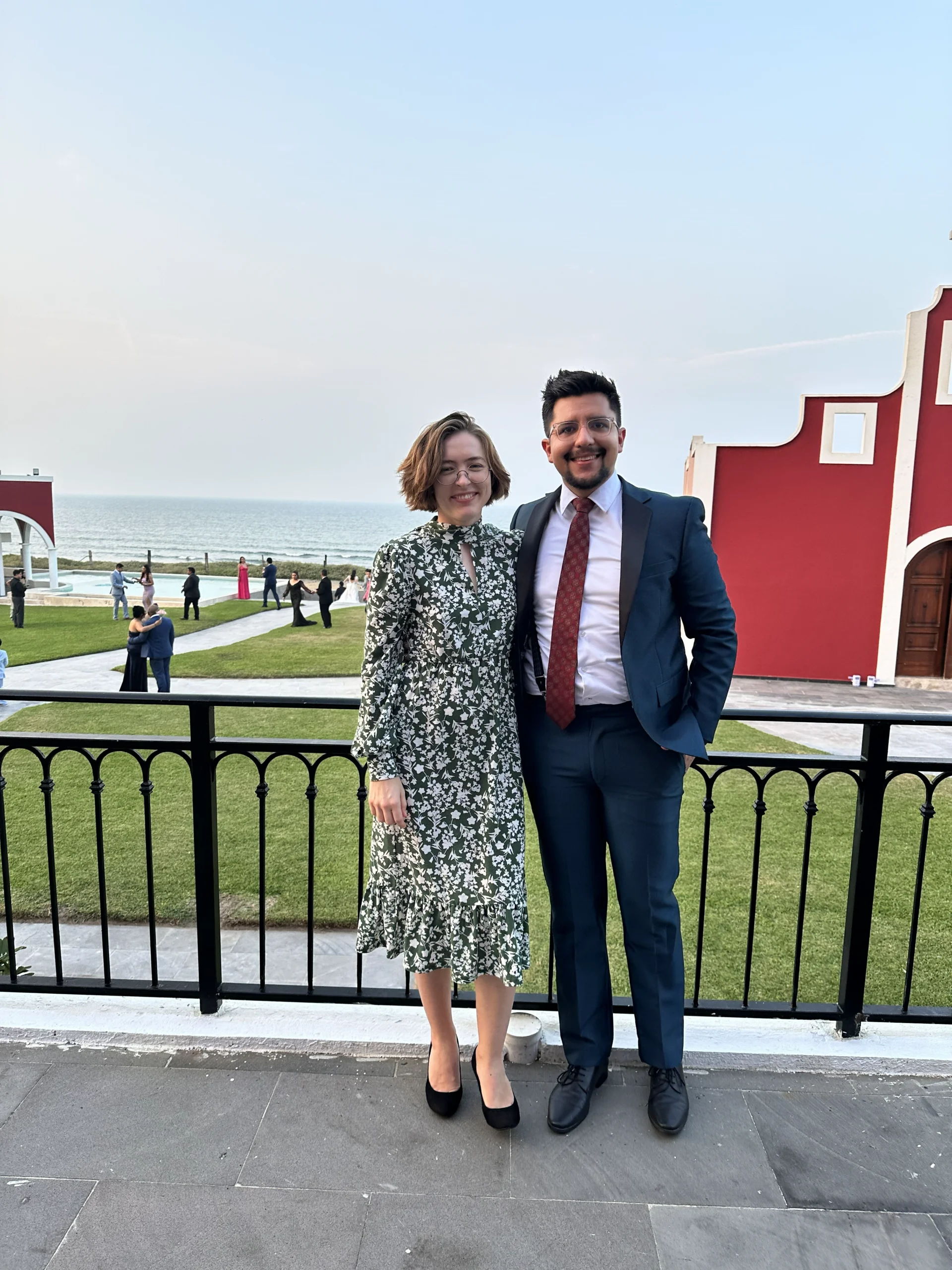 Alexis and his girlfriend posing outside of a church