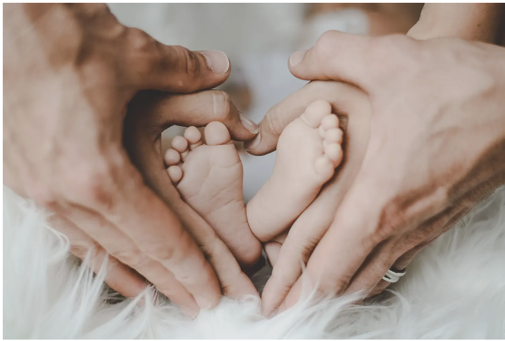 baby-feet Brain scan being held up by doctor.